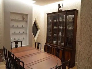 Dining area with table and cabinet
