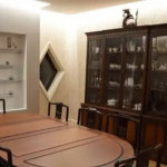 Dining area with table and cabinet