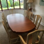 Wooden table with cream chairs